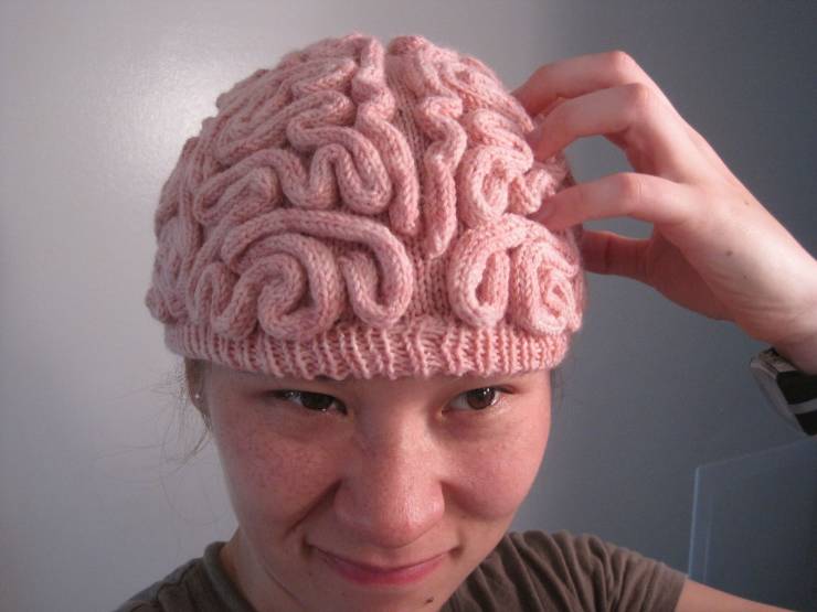 cool pics - woman scratching pink knitted brain hat