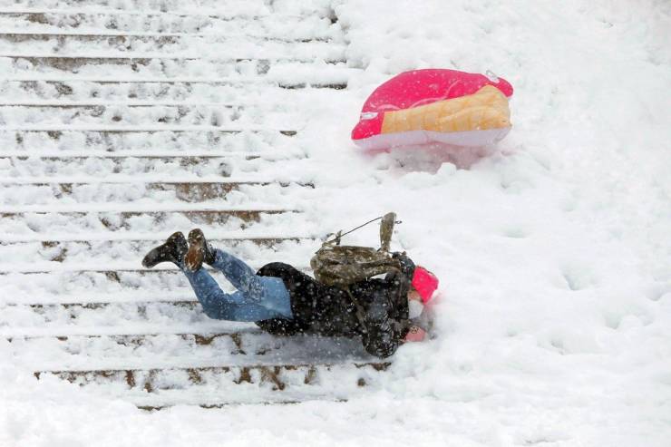 cool pics - person falling down a snowy set of stairs