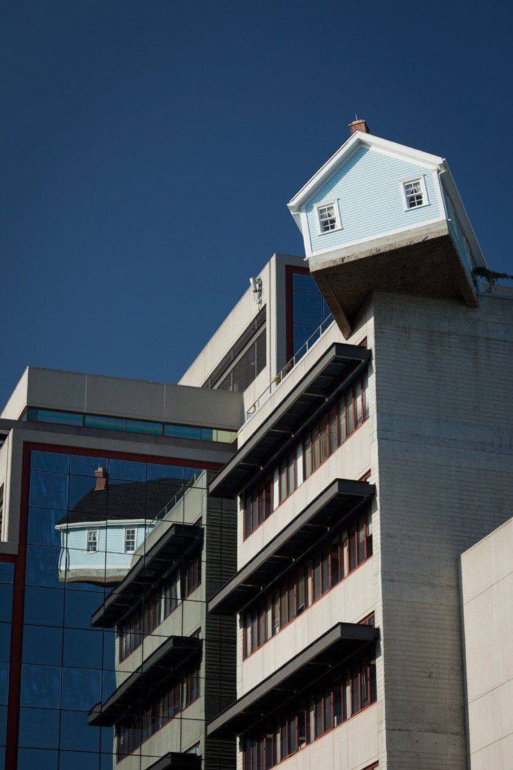 cool pics - apartment building with mini house built on the top corner