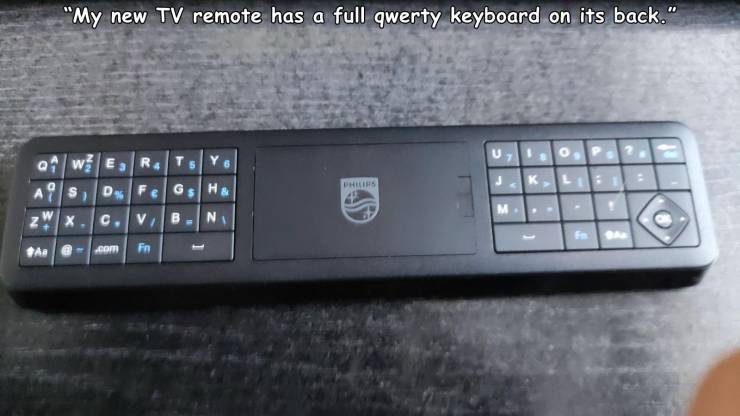 electronics - "My new Tv remote has a full qwerty keyboard on its back." Ts U 7 Wer S D F G H & X.C Vb Ni M. Z F the om Fn