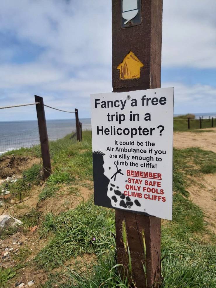 sign - Fancy'a free trip in a Helicopter? It could be the Air Ambulance if you are silly enough to climb the cliffs! Remember Stay Safe Only Fools Climb Cliffs