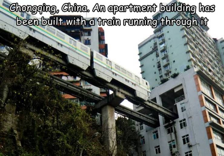chong qing metro - Chongqing, China. An apartment building has been built with a train running through it