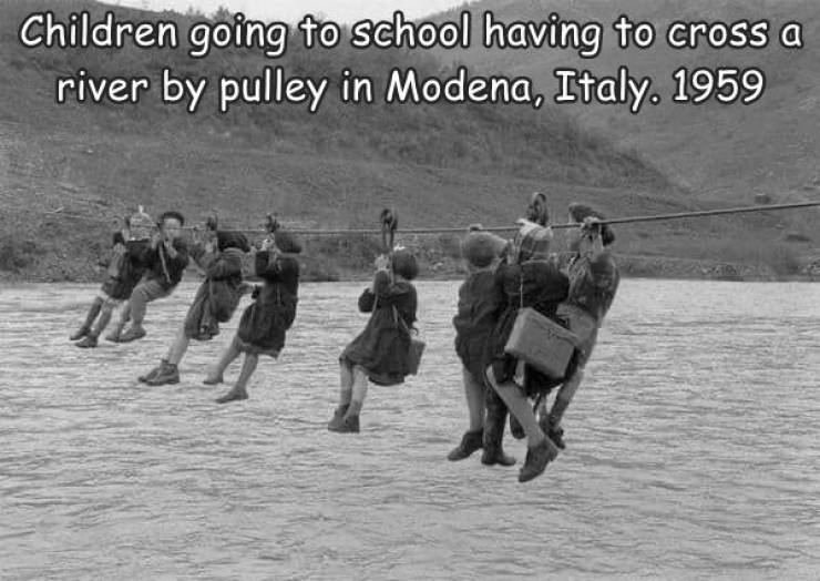 children going to school by pulley in modena italy 1959 - Children going to school having to cross a river by pulley in Modena, Italy. 1959