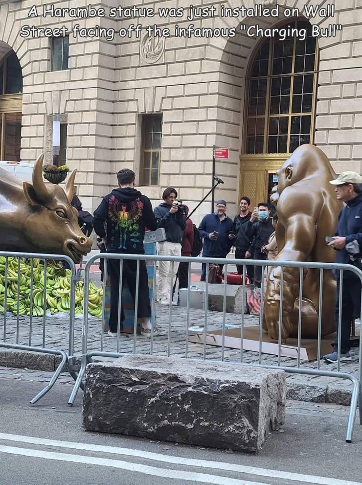 cool and interesting random pics -  statue - A Harambe statue was just installed on Wall Street facing off the infamous "Charging Bull the