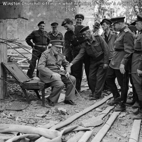 fun randoms - funny photos - churchill in hitler's chair - Winston Churchill sitting in what remains of Hitler's Arm chair, 1945