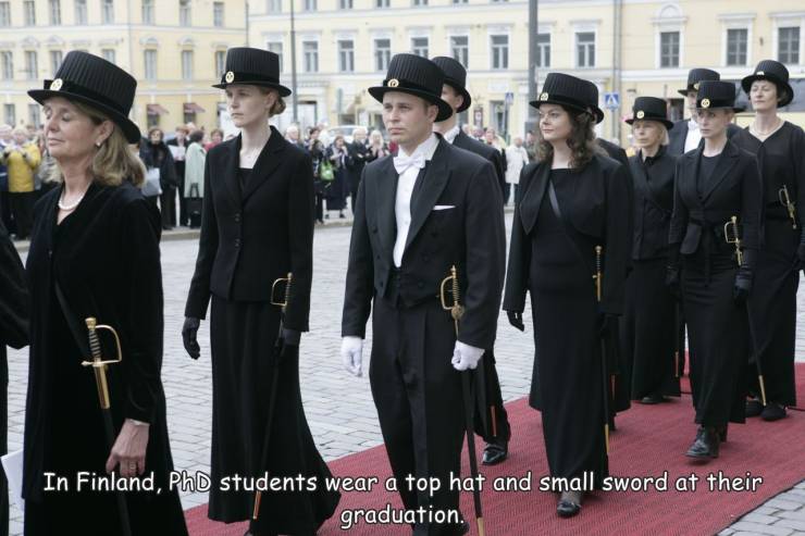 fun randoms - funny photos - finland phd sword and hat - Full In Finland, PhD students wear a top hat and small sword at their graduation.