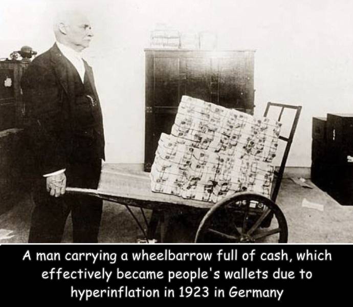 weimar republic inflation - st A man carrying a wheelbarrow full of cash, which effectively became people's wallets due to hyperinflation in 1923 in Germany