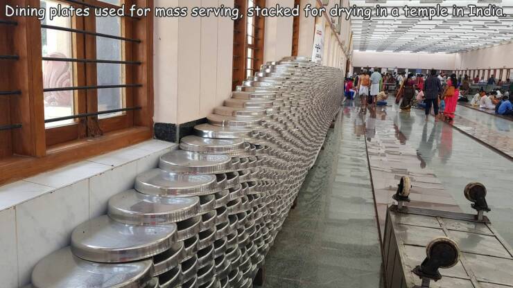 random pics - tourist attraction - Dining plates used for mass serving, stacked for drying in a temple in India. 40