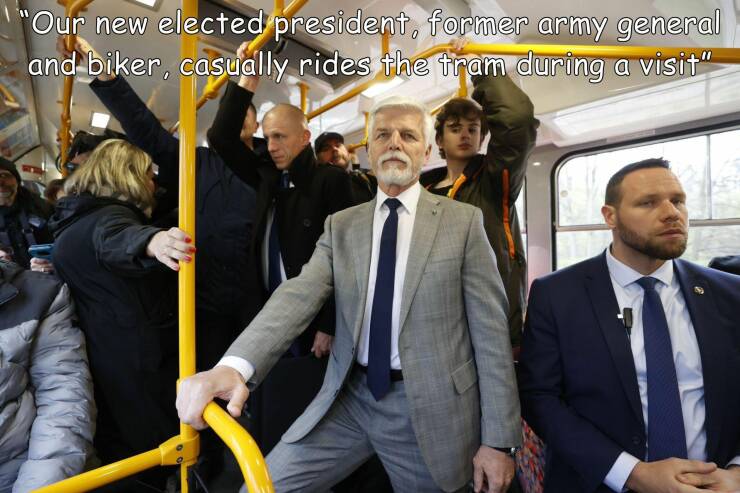 cool random pics - suit - "Our new elected president, former army general and biker, casually rides the tram during a visit"