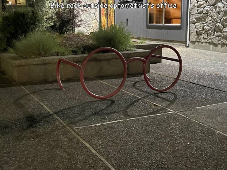 cool random pics - asphalt - Bike rack outside optometrist's office