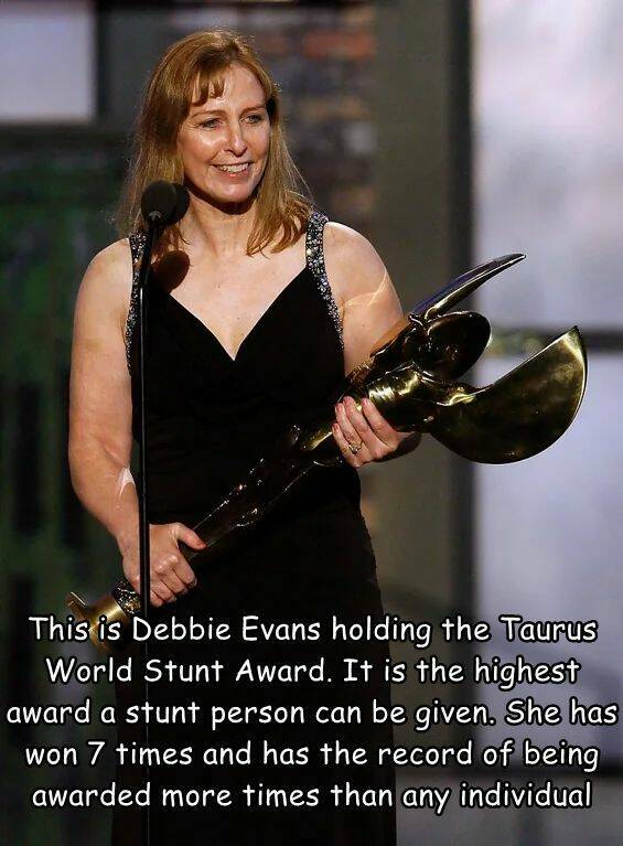 cool random pics - photo caption - This is Debbie Evans holding the Taurus World Stunt Award. It is the highest award a stunt person can be given. She has won 7 times and has the record of being awarded more times than any individual