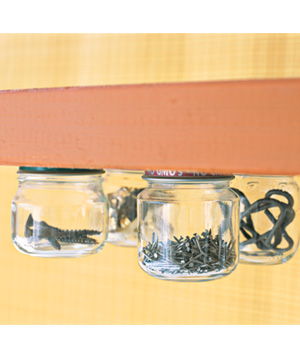 Attach jar lids to the underside of cabinets or shelves to organize all of the little things. Perfect for craft items, nuts and bolts, girls' hair accessories, or any other small items you have laying around the house.