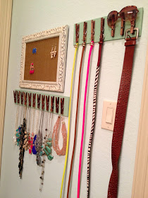 Glue some clothespins or use screw hooks on a strip of wood for a creative way to organize belts and necklaces. You could also use the clothes pins to hang a small box or basket for chunky bracelets or other items that wont fit the clothespins.