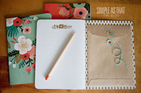Glue an envelope to the inside of your journal or a notebook to store all of those little keepsakes or current projects.