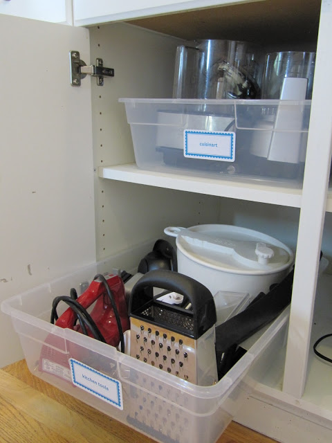 Place your kitchen items inside a plastic tub before storing them in your cupboards. No more digging for stuff in the back. This would also work great in the bathroom or garage.