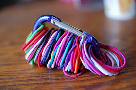 Organize hair ties with a carabiner. Attach a hook to the inside of a cabinet to keep your hair ties easily accessible.