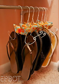 Use wire hangers to organize your shoes and keep them off the floor. Just bend the hangers like the ones in the photo above and decorate with paper or fabric.
