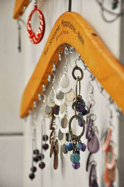 Screw eye screws into a wooden hanger to organize earrings and necklaces.