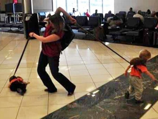 This mom who is making a valiant effort to board her plane on time.