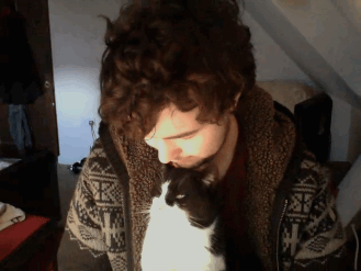 gifs - man kisses his cat and gets one back from his cat