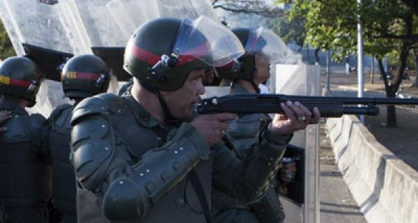 Nicolas Maduro armed forces shooting at protesters.