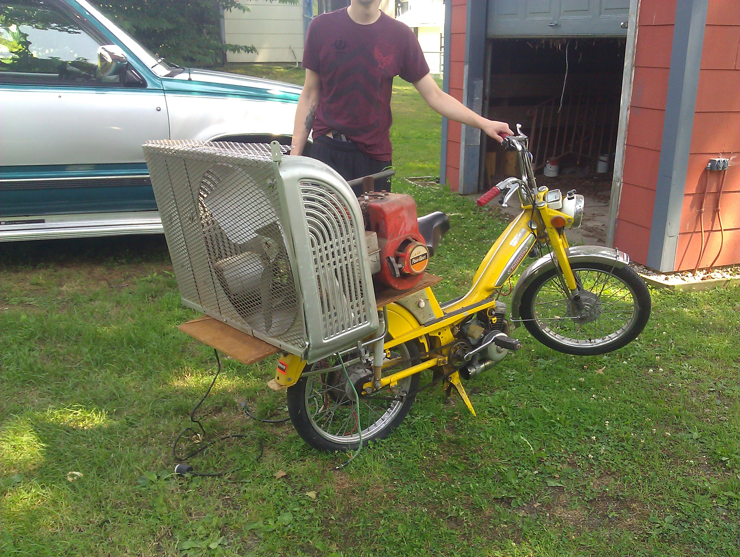 My friend and I have created an Eco-friendly Hybrid motorcycle. As you can see it is very practical.

1. Find a moped with a broken engine
2. Find a generator
3. Find a fan
4. Bolt it together
5. Pickup ladies