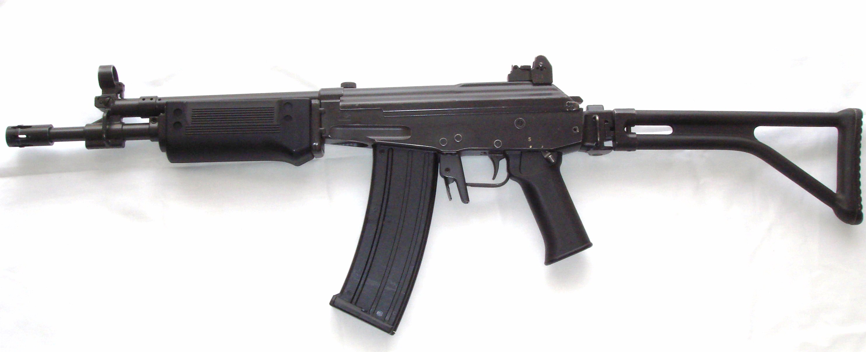 This Is A Galil... It Has A Standard Color... It's Regular Magazine Holds 30 To 35 Bullets... And It's Extended Mags Hold About 40 Bullets... Enjoy The Photo... ;)