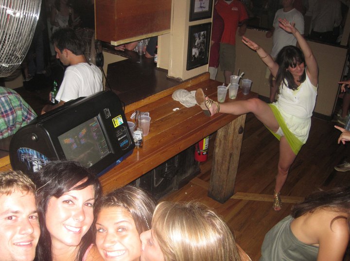 A friends bad aim with the camera resulted in the capture of a drunk bachelorette in the background doing her thang