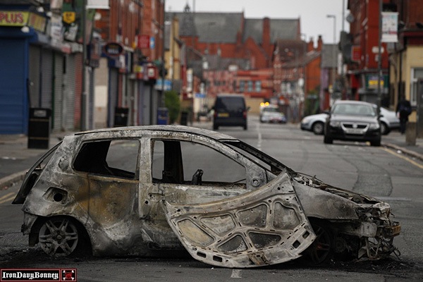 Burnt Out Cars - A burnt out car is pictured in Toxteth, Liverpool, following a fourth night of violence in Britain.