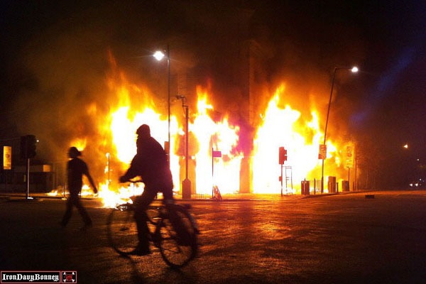 London Burns - A Carpetright store burns in Tottenham after being set on fire by youths.