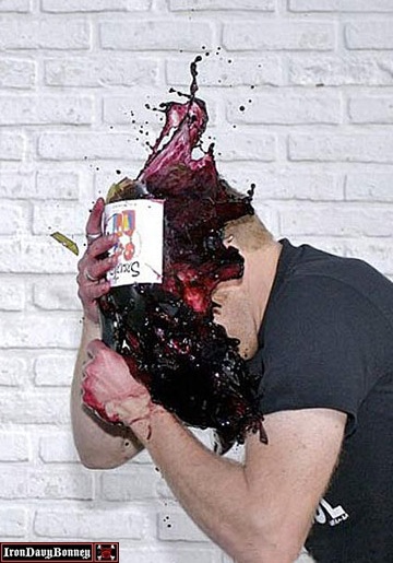Slow Motion Pic of man hitting self with wine bottle