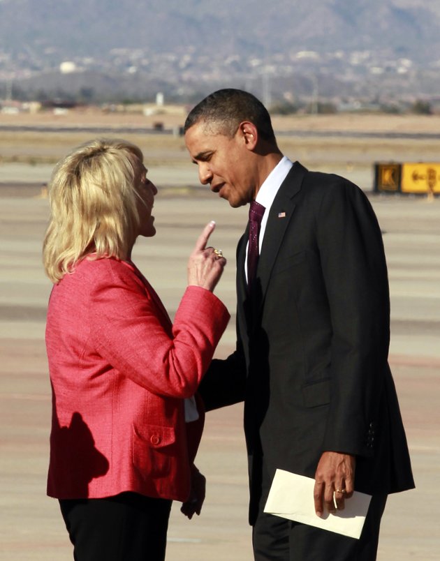 Arizona Gov. Jan Brewer says she meant to slap Obama when she pointed a finger at the boy while talking on an airport tarmac. "Keep messing with Arizona and we'll kick your ass!" She said.