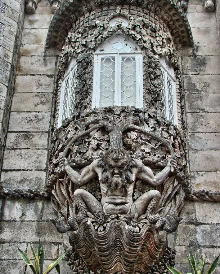 Bay window with Triton, the Greek god of the sea at Pena Palace in São Pedro de Penaferrim, in the municipality of Sintra, on the Portuguese Riviera.