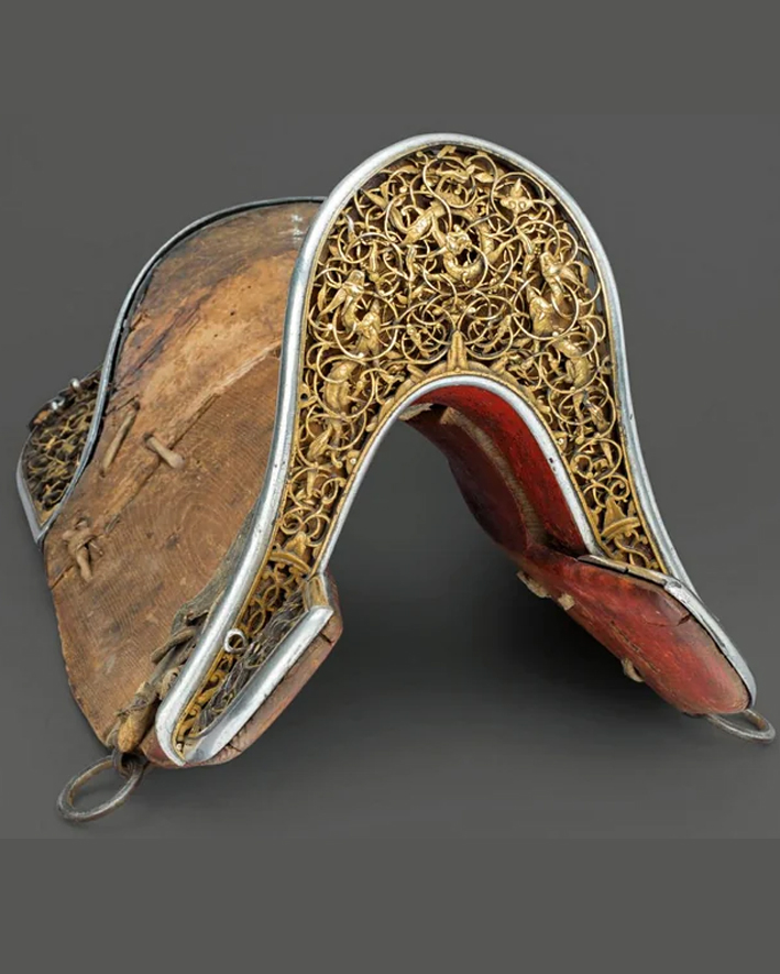 Saddle with ornate gold plates. Tibet, 15th-17th century.
