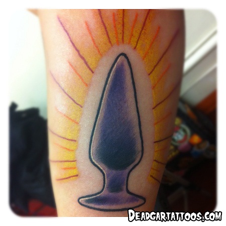 Sacred Butt Plug Tattoo on inner arm