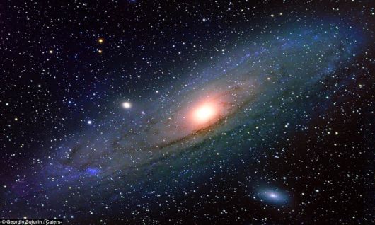 Mr. Suturin's image of the Andromeda Galaxy, a spiral galaxy approximately 2.5 million light-years from Earth, can be seen in all its oval glory