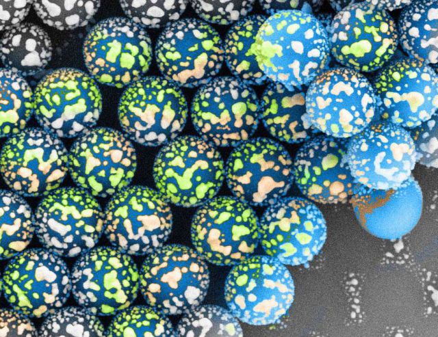 Silver clusters deposited by thermal evaporation onto self-assembled polystyrene nano-spheres 900 nm.