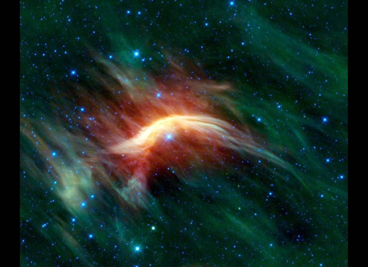 A massive star is shown plowing through space dust