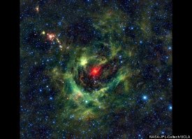 Celestial Shamrock a region of star birth wrapped in a blanket of dust, colored green in this infrared view.