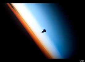 The silhouette of the space shuttle Endeavour, Feb 9, 2010