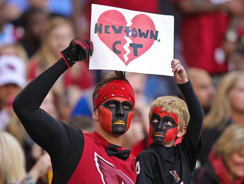 Arizona Cardinals fans express their sympathy for the victims of Friday's massacre.