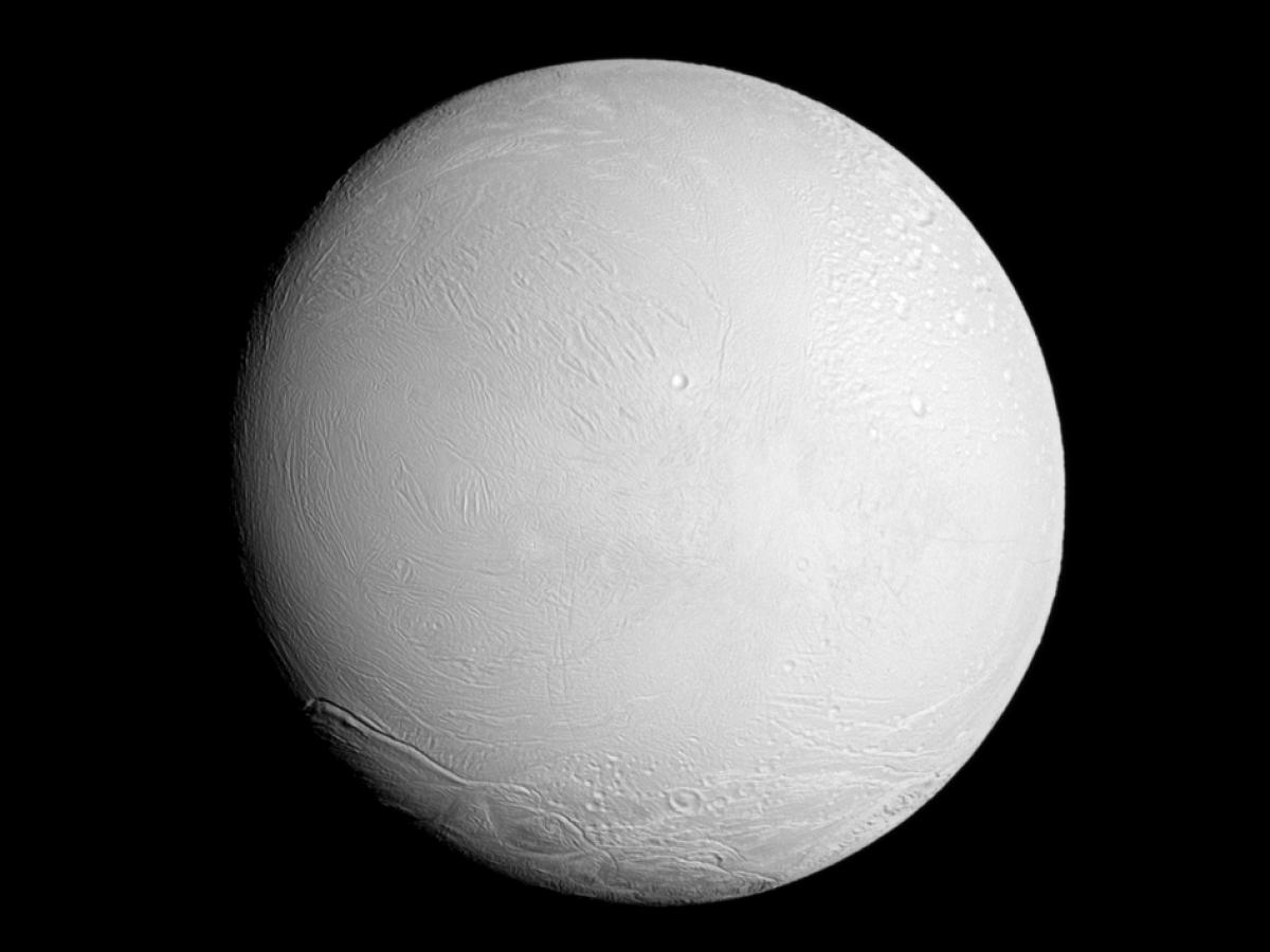 The Cassini spacecraft looks at a brightly illuminated Enceladus and examines the surface of the leading hemisphere of this Saturnian moon.