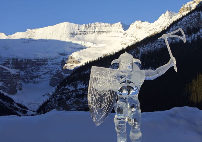 An ice sculpture appears to be charging forward from the Canadian Rockies at the Ice Magic Festival in Banff National Park, Canada.