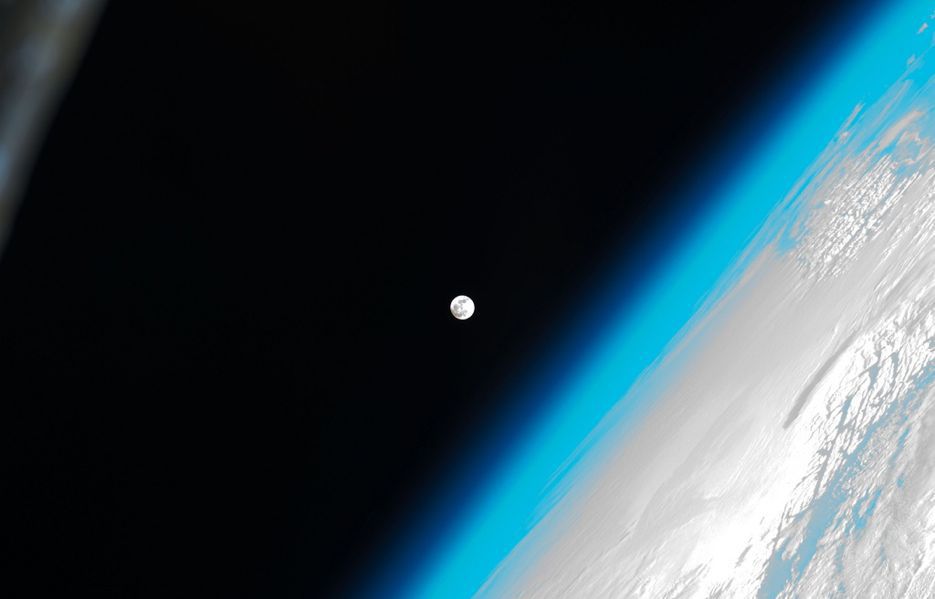 This stunning photo shows the moon and Earth's atmosphere as seen from the International Space Station