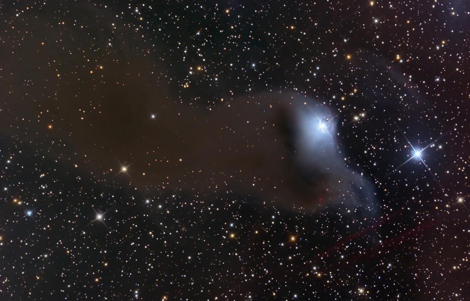 Described as a "dusty curtain" or "ghostly apparition," mysterious reflection nebula VdB 152 is very faint. Also called Ced 201, it is nearly 1,400 light years away.