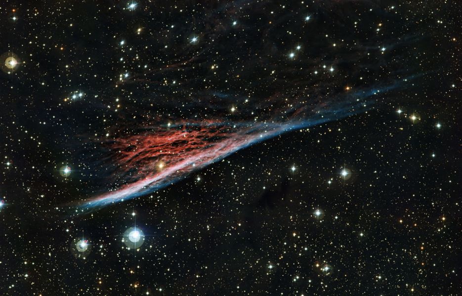 Called the Pencil Nebula, this streak of vibrant red and blue is part of a ring of wreckage resulting from a supernova explosion that occurred 11,000 years ago