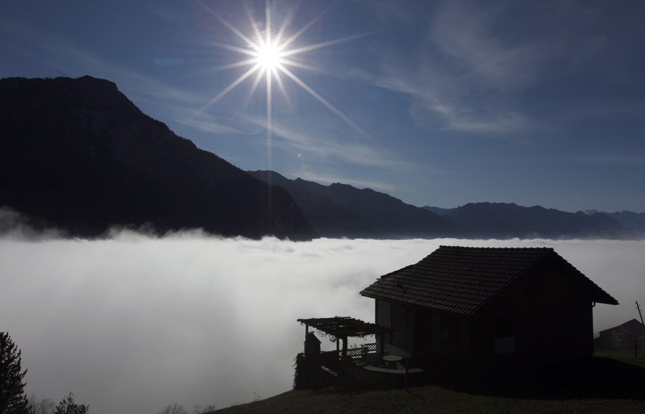 The sun shines above the fog level on the Mueterschwandenberg Mountain in Ennetmoos, Switzerland.