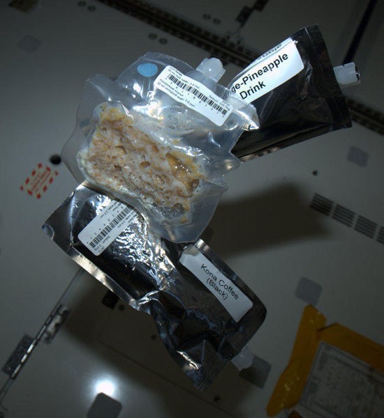 "Astronaut's Breakfast - corn flakes, juice and coffee. Flakes in a bag with powdered milk, coffee through a straw."