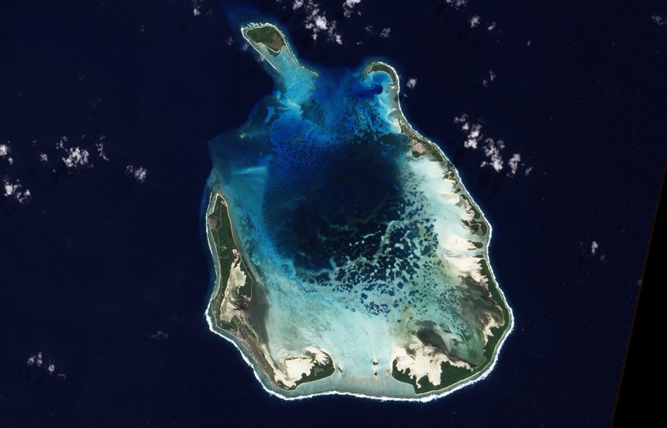 The Cocos Islands, northwest of Australia in the Indian Ocean, are composed largely of coral atolls. In this image, shallow water above the coral is aquamarine.