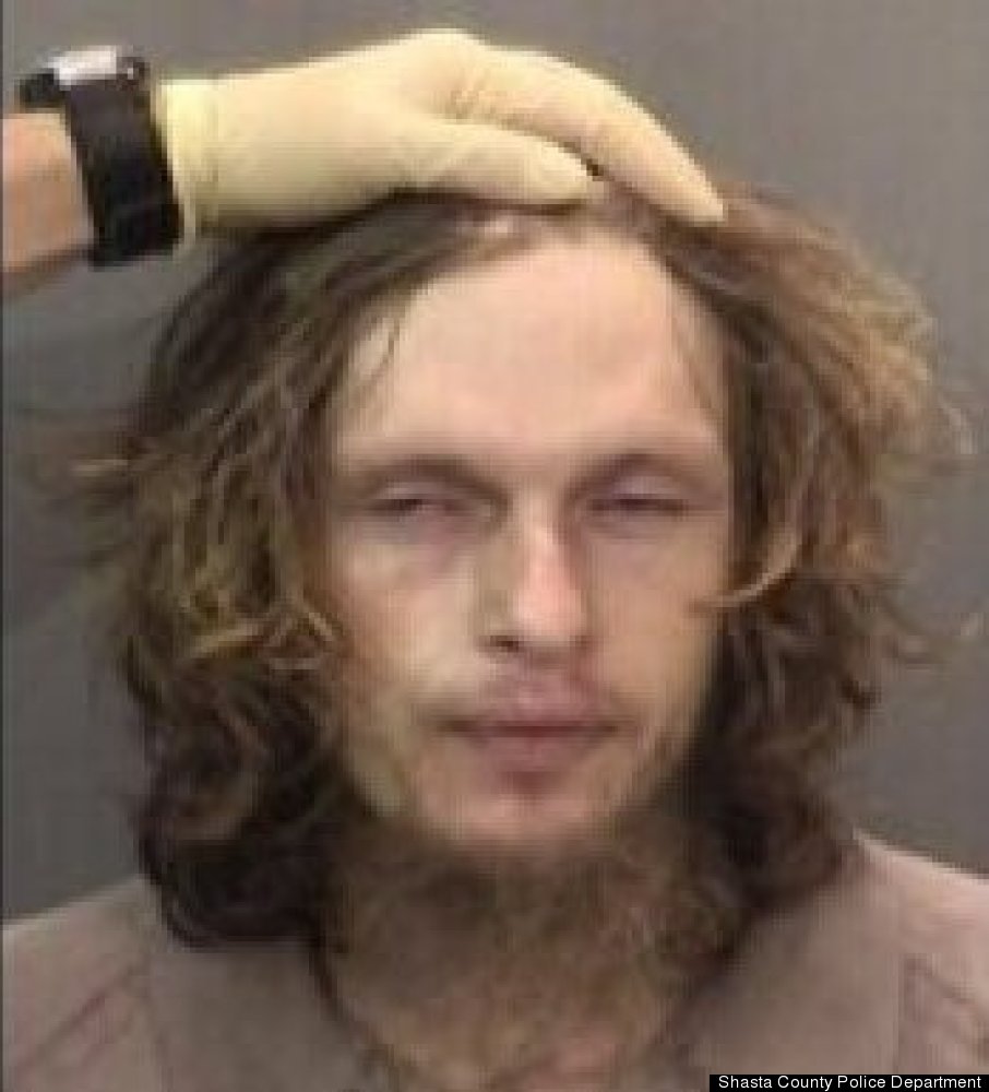 Arrested on suspicion of burglary, this guy refused to move his hair out of his face of his mugshot.